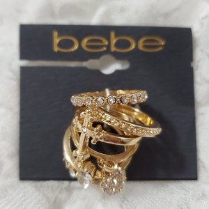 bebe gold tone with glass crystals 6 ring stackable heart cross NWT!